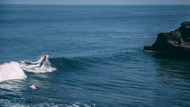 surfer on a wave in Uluwatu Indonesia