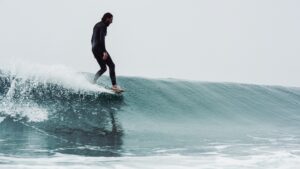 Peniche Surf Camp for Beginners and surfer on a wave