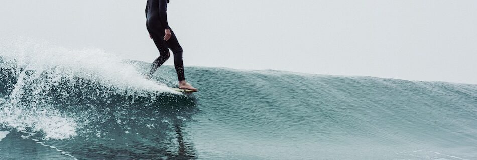 Peniche Surf Camp for Beginners and surfer on a wave