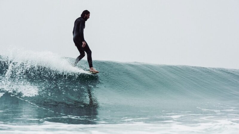 Which Peniche Surf Camp for Beginners Is Worth Booking? My Full Comparison Peniche Surf Camp for Beginners and surfer on a wave
