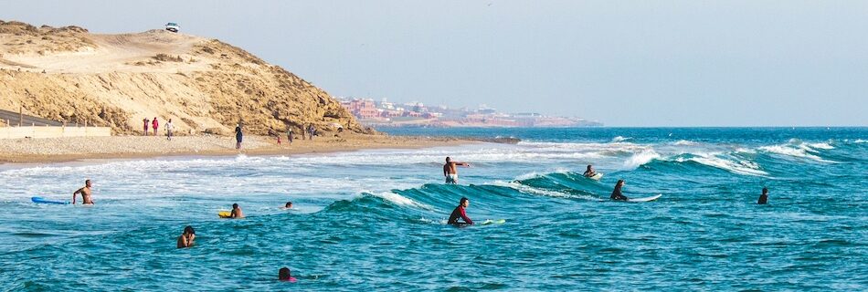 Surfers in the lineup with the best surf camp in Taghazout