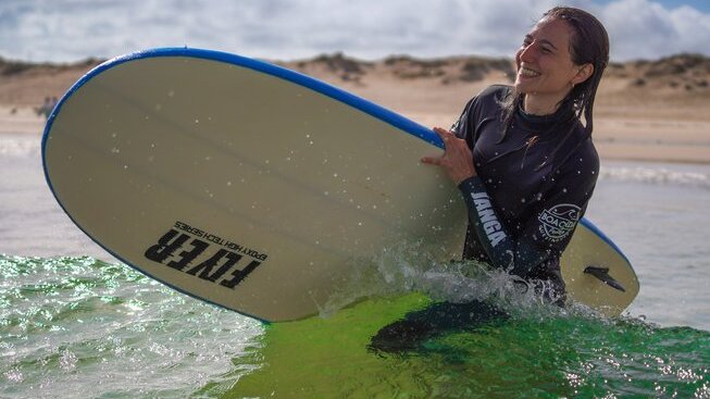 learner surfer happy in the surf with Boa Onda Guesthouse