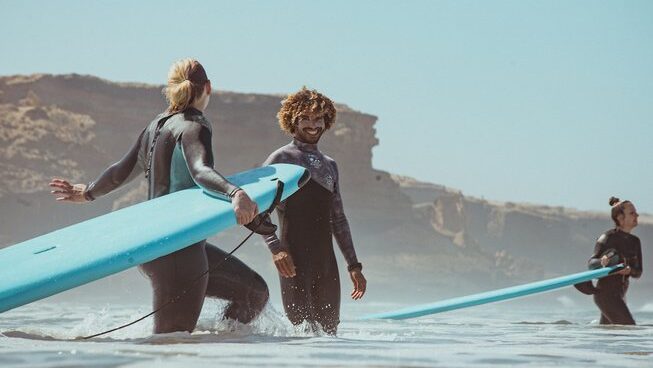learner surfers learning how to surf in the ocean at Taghazout