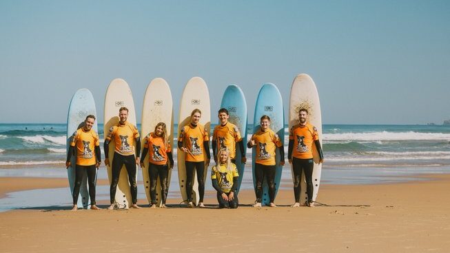 learner surfers standing in a row