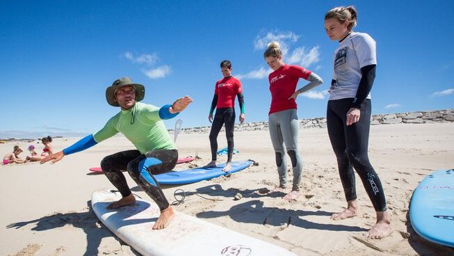 learners practicing how to surf with Star Pine Lodge
