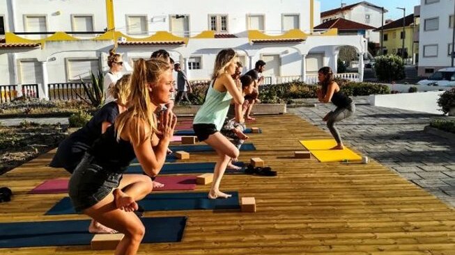 people in a yoga pose with Boa Onda Guesthouse