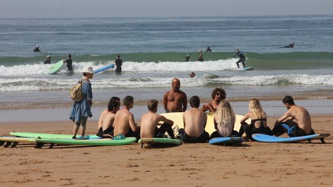 surfers and learners on the beach learning with Surf Coast Morocco