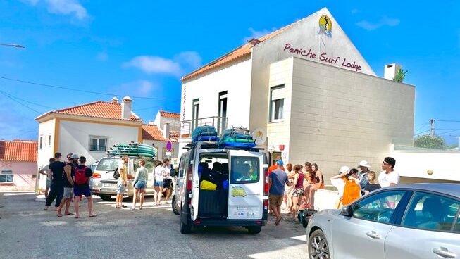 surfers getting ready to go surfing with Peniche Surf Lodge